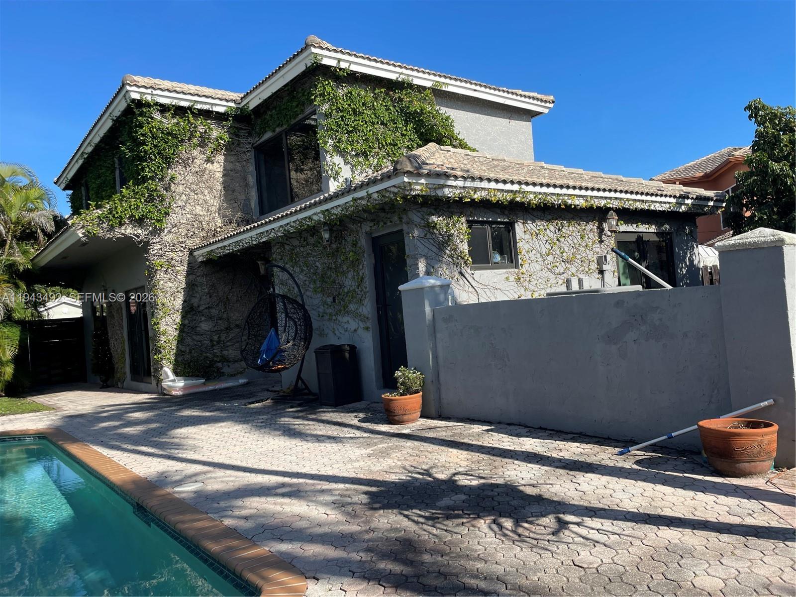 15448 Southwest 92nd Street Miami, FL 33196 - Photo 24 of 36 a view of a car garage