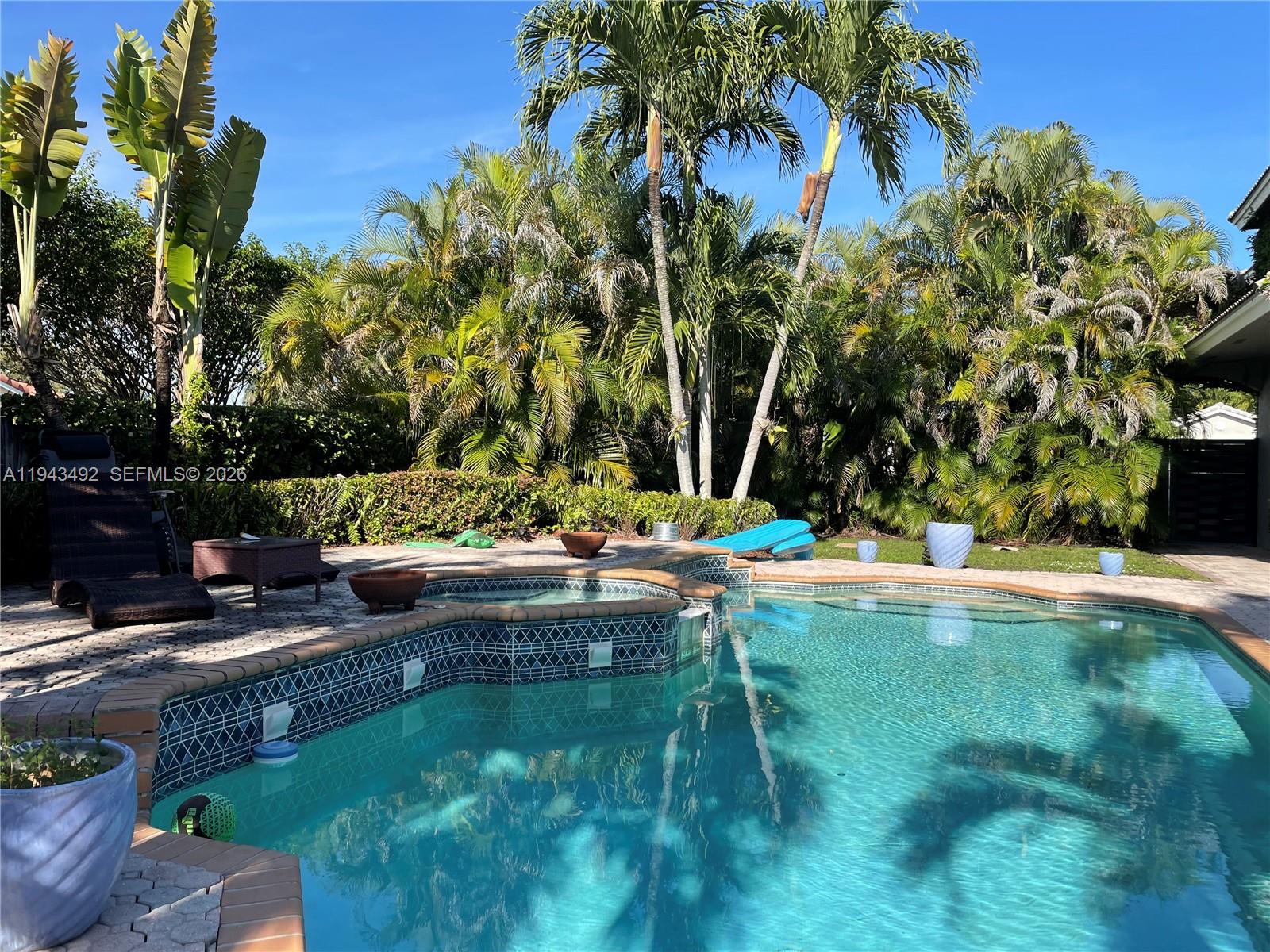 15448 Southwest 92nd Street Miami, FL 33196 - Photo 25 of 36 a view of swimming pool with a yard