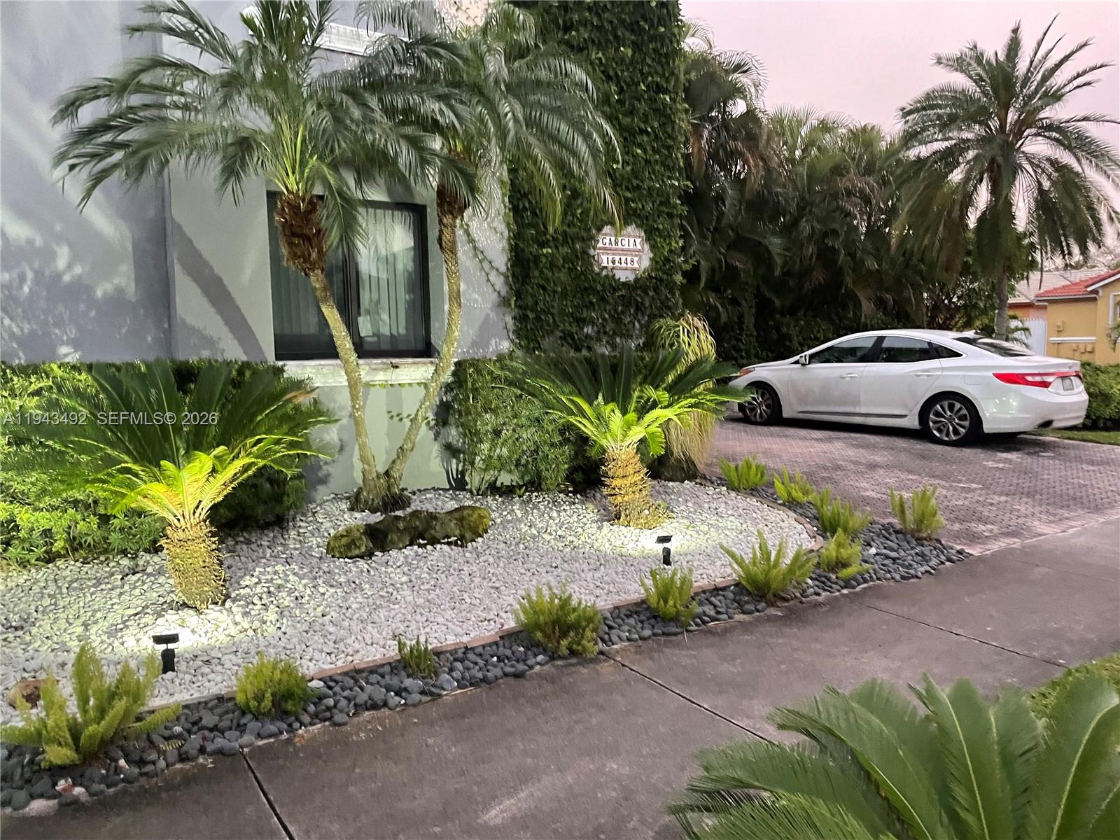 15448 Southwest 92nd Street Miami, FL 33196 - Photo 26 of 36 a view of a street with a car parked