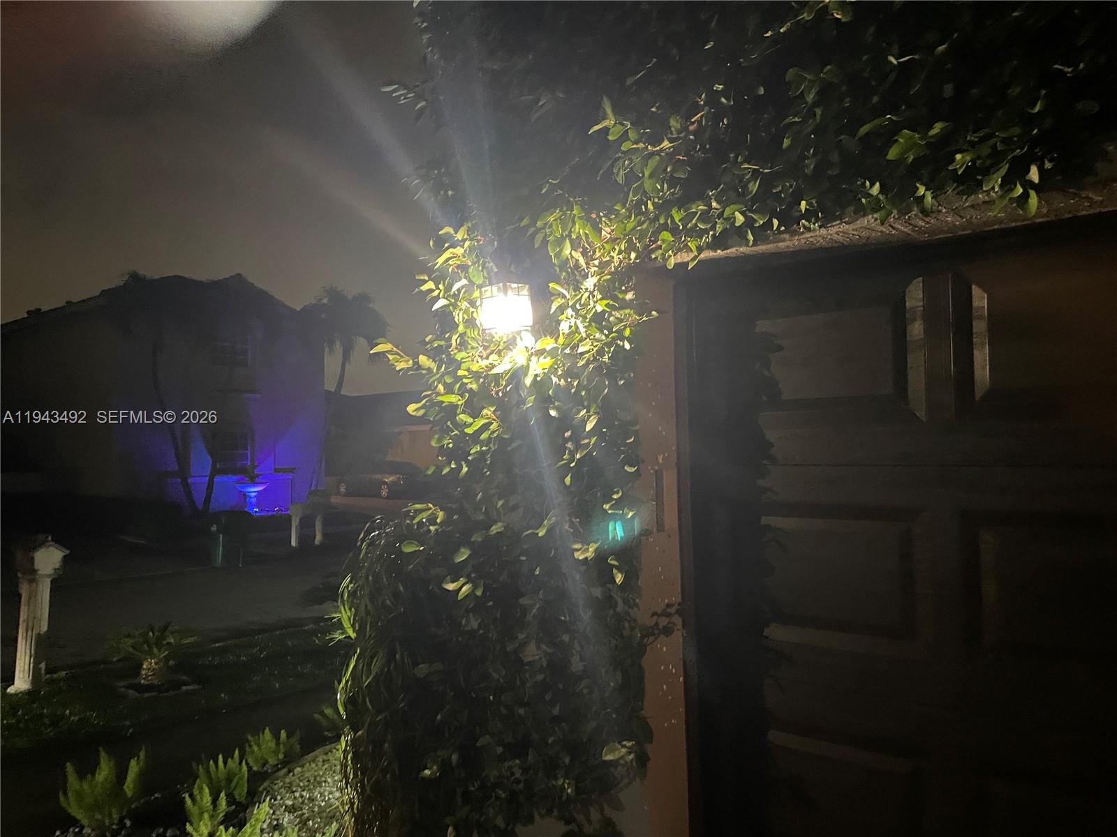 15448 Southwest 92nd Street Miami, FL 33196 - Photo 32 of 36 a view of a house with a tree