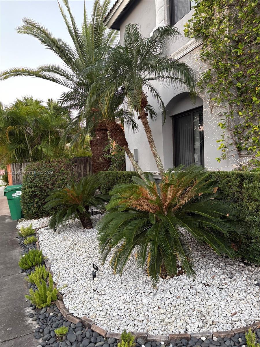 15448 Southwest 92nd Street Miami, FL 33196 - Photo 36 of 36 a front view of a house with a yard