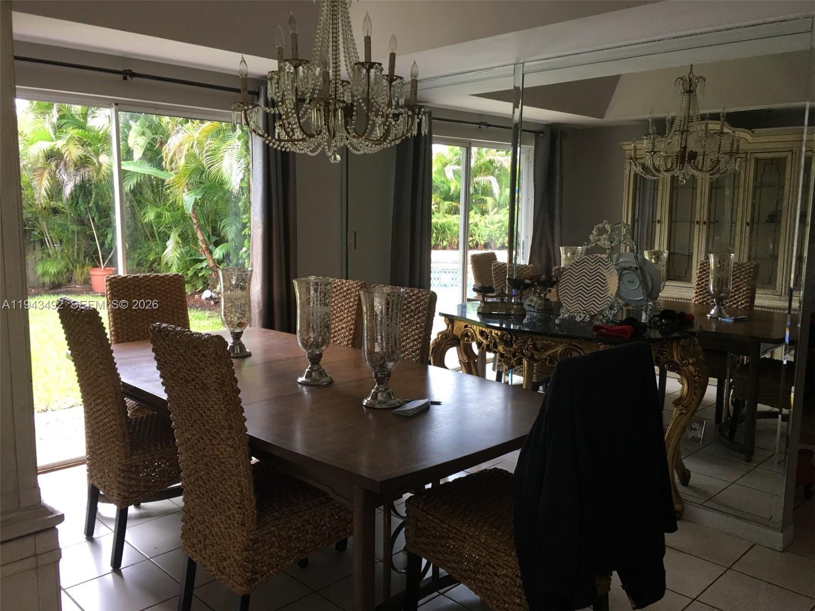 15448 Southwest 92nd Street Miami, FL 33196 - Photo 6 of 36 a view of a dining room with furniture window and outside view