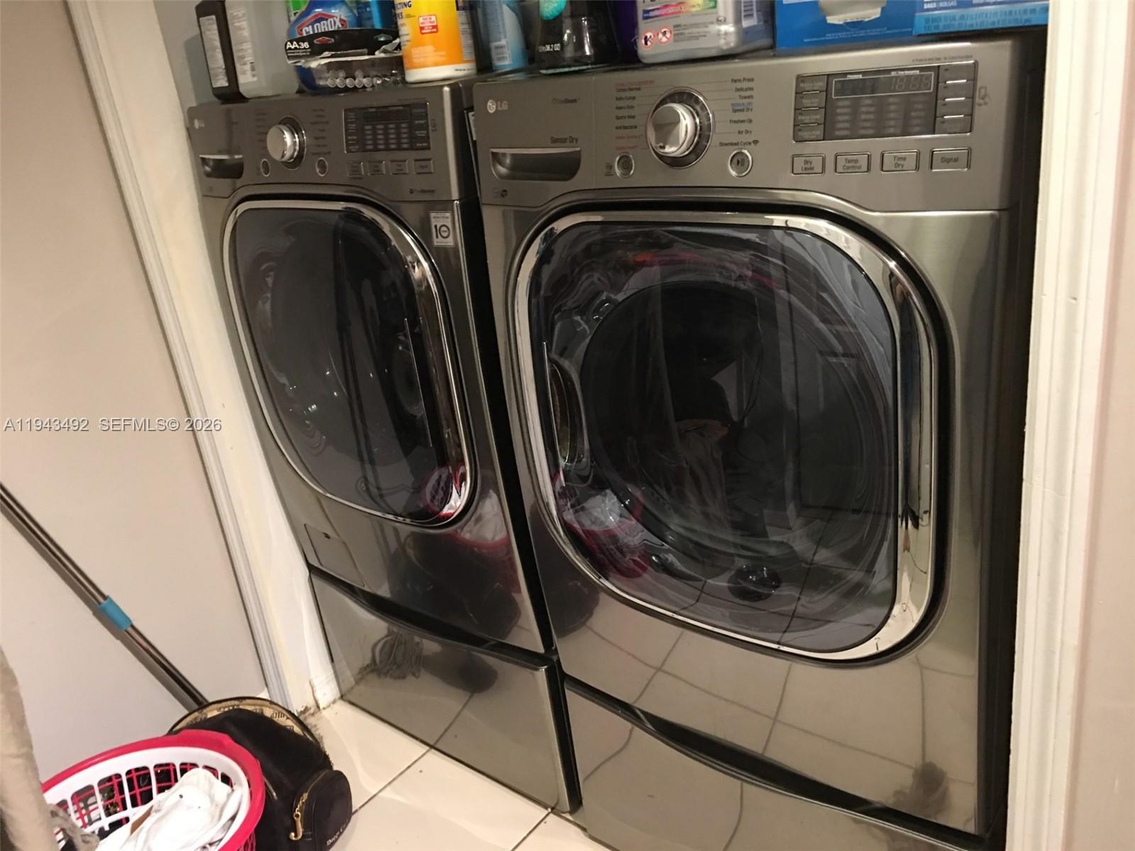 15448 Southwest 92nd Street Miami, FL 33196 - Photo 10 of 36 a utility room with dryer and washer