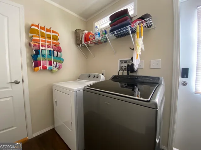 a kitchen with a refrigerator and cabinets