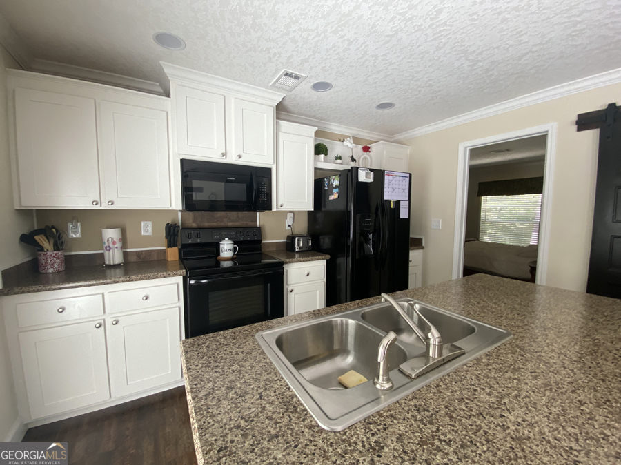 347 River Trail Martin, GA 30557 - Photo 4 of 29 a kitchen with a sink a stove and refrigerator