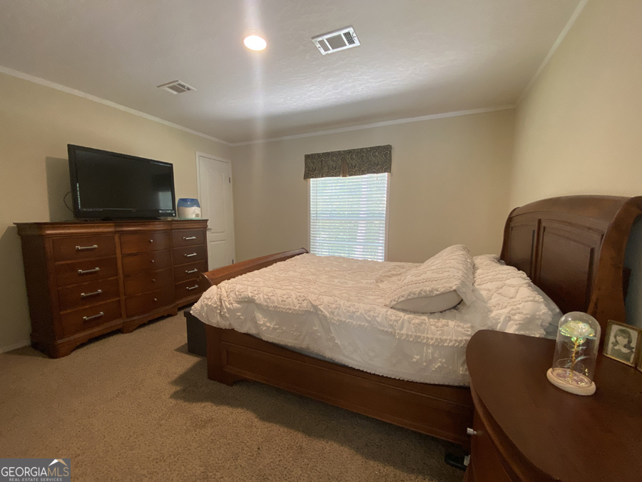 347 River Trail Martin, GA 30557 - Photo 6 of 29 a bedroom with a bed and flat screen tv