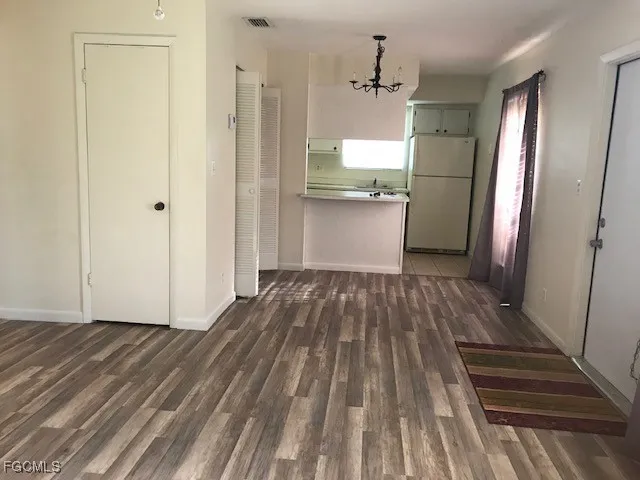 a view of a kitchen from the hallway