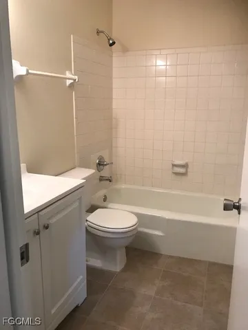 a bathroom with a toilet a sink and a bathtub