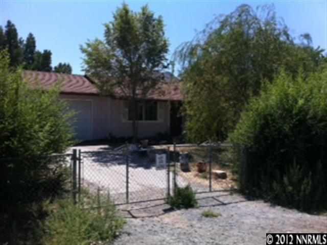 9060 Turbine Way Reno, NV 89506 - Photo 1 of 1 a view of backyard with outdoor seating and green space