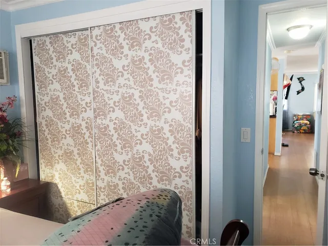 a front view of a house with a big yard and potted plants