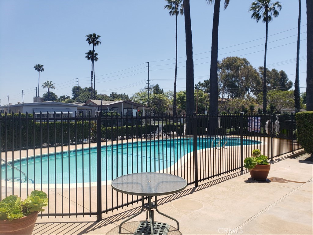 3929 West 5th Street, Unit 16 Santa Ana, CA 92703 - Photo 21 of 21 a view of a chair and tables in the patio