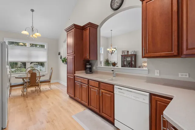 a spacious bathroom with a sink a mirror and a bathtub