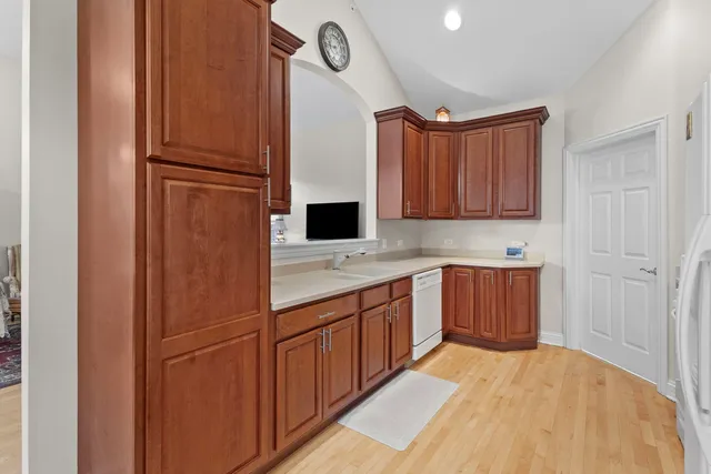 a kitchen with stainless steel appliances a refrigerator and cabinets
