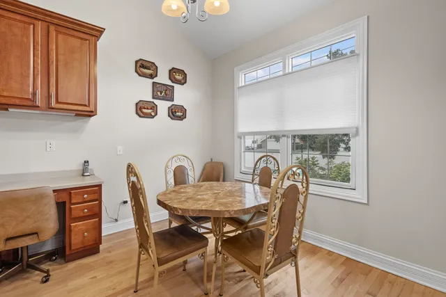 a view of a dining room that has a table and chairs in it