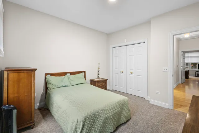 a bedroom with a bed and painted walls