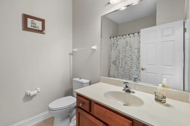 a bathroom with a sink toilet and vanity