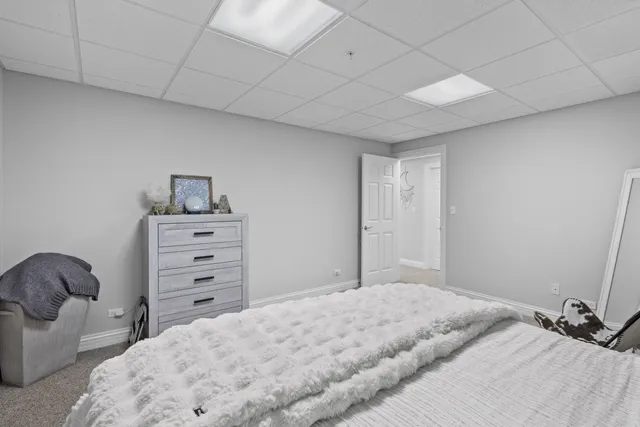 a bedroom with a bed and a cabinets