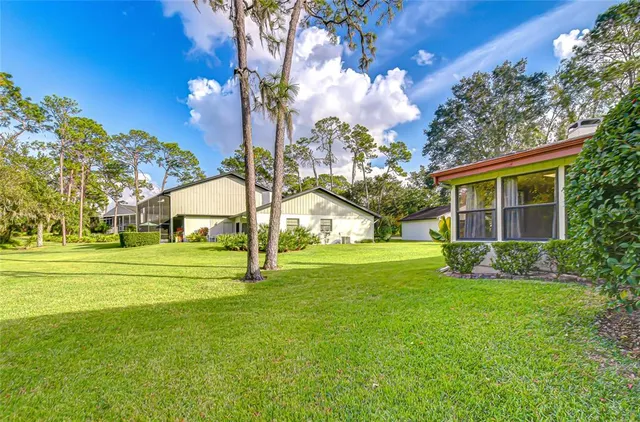 a view of a house with a big yard