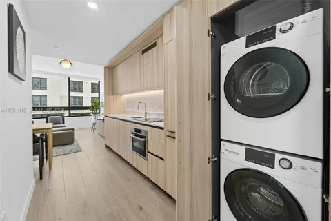 a kitchen with stainless steel appliances refrigerator and cabinets