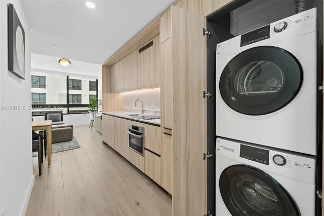 a kitchen with stainless steel appliances refrigerator and cabinets