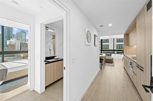 a kitchen with a refrigerator and a stove