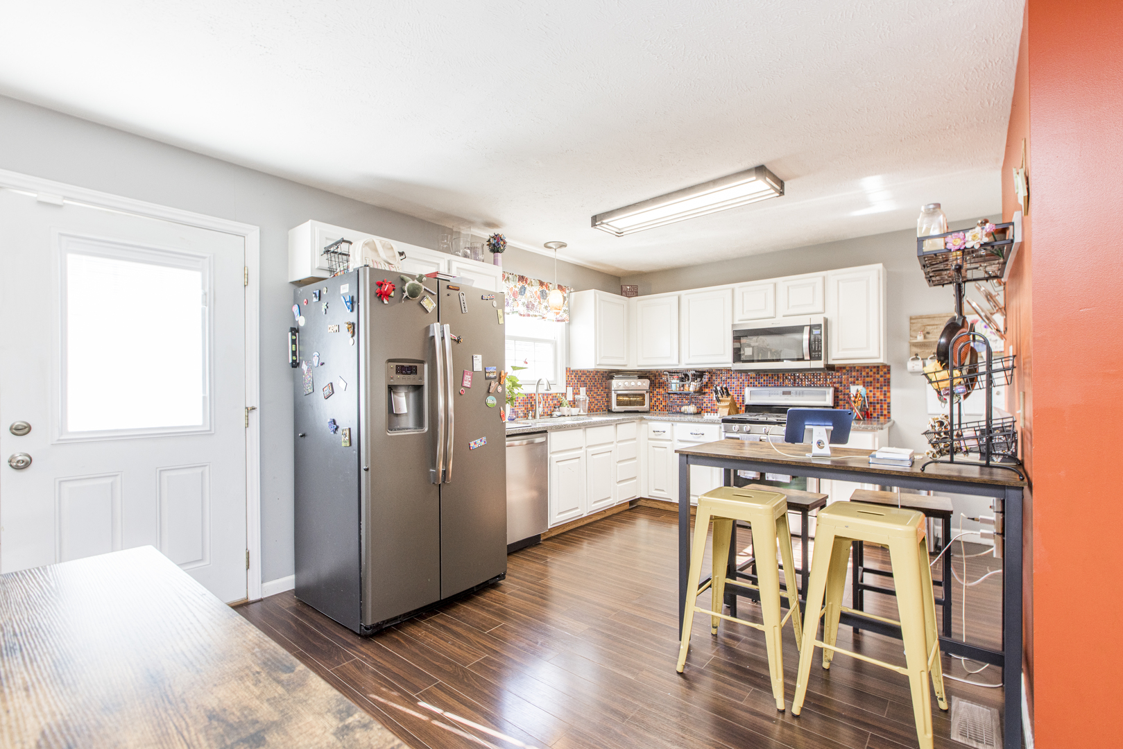 1111 Chippewa Street Normal, IL 61761 - Photo 11 of 35 a kitchen with stainless steel appliances a refrigerator a stove top oven and white walls