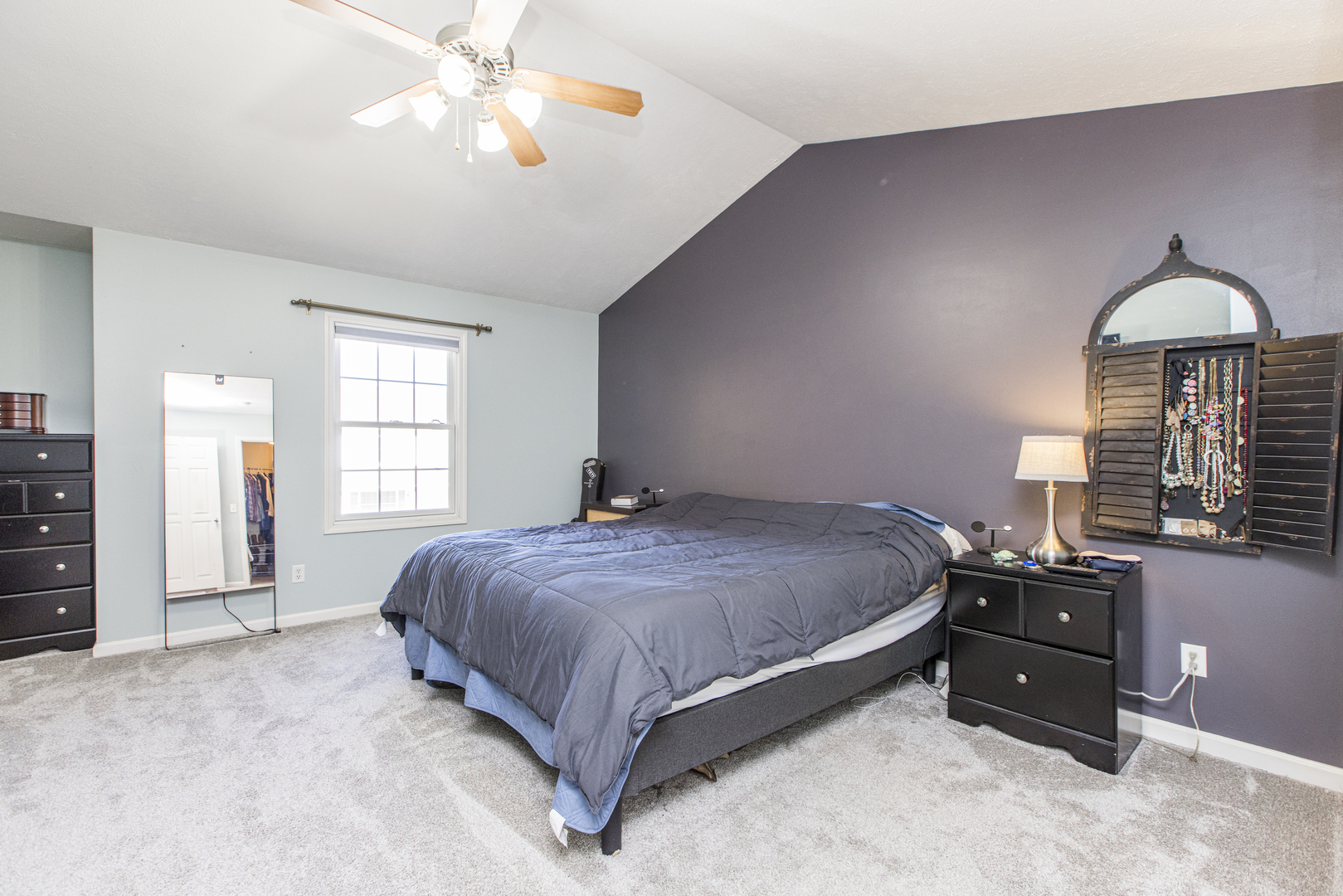 1111 Chippewa Street Normal, IL 61761 - Photo 15 of 35 a bedroom with a bed and a chandelier