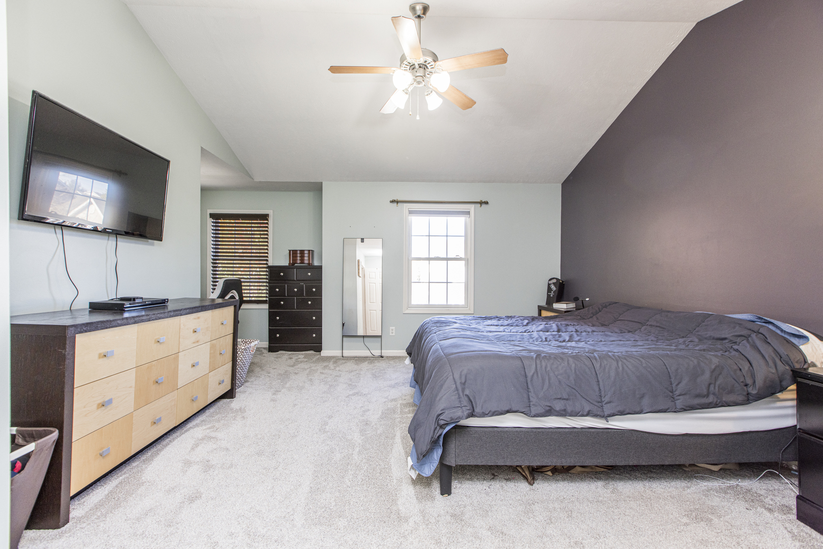 1111 Chippewa Street Normal, IL 61761 - Photo 16 of 35 a spacious bedroom with a bed and a flat screen tv