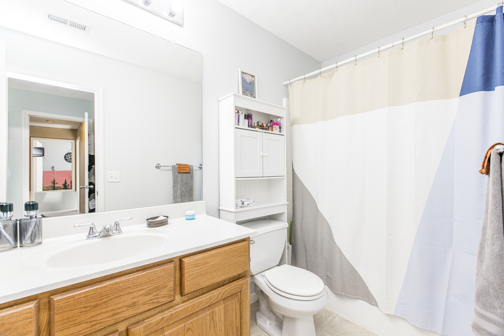 1111 Chippewa Street Normal, IL 61761 - Photo 19 of 35 a bathroom with a sink a toilet and a large mirror