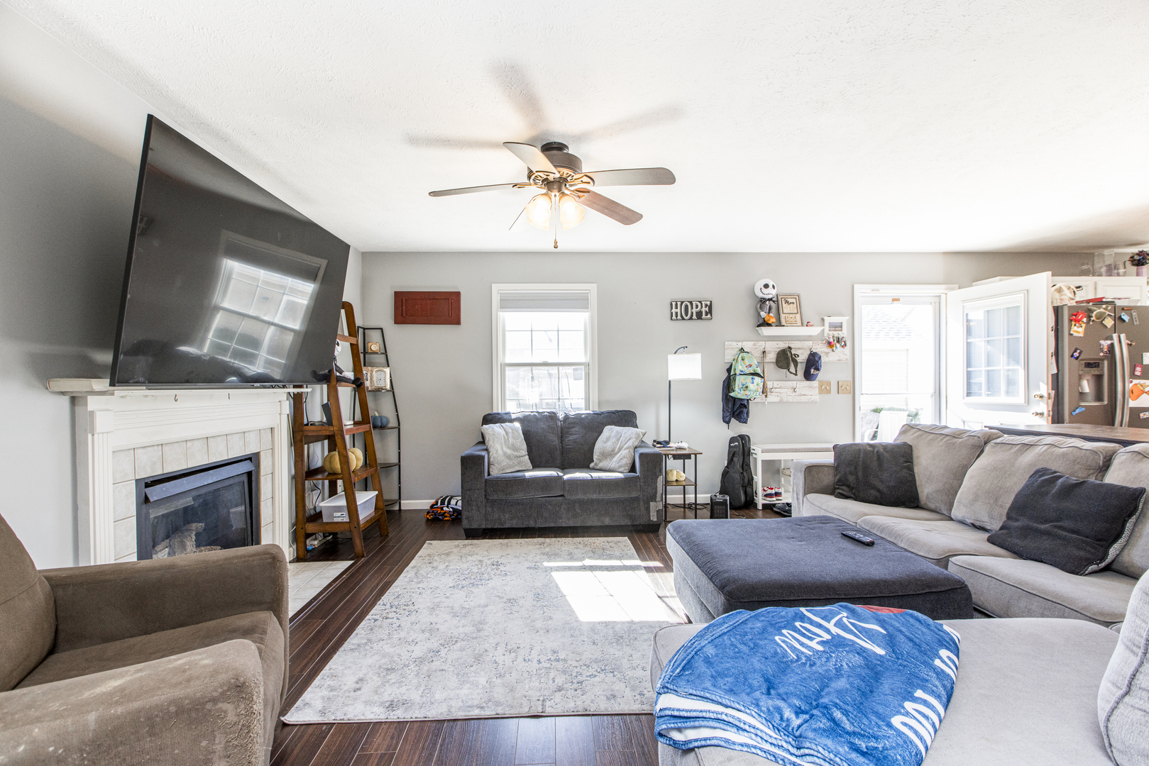 1111 Chippewa Street Normal, IL 61761 - Photo 9 of 35 a living room with furniture a fireplace and a flat screen tv
