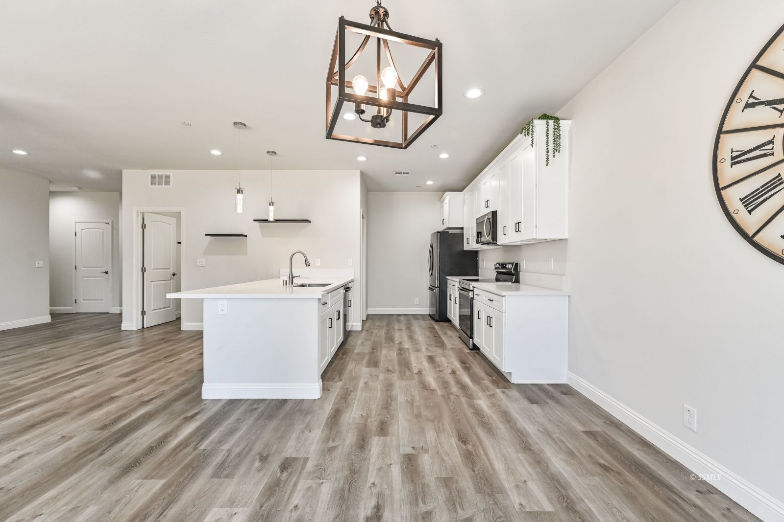 1031 West Church Avenue Ridgecrest, CA 93555 - Photo 6 of 49 a view of kitchen with cabinets and wooden floor