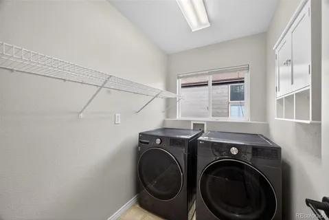 a bathroom with a granite countertop sink a toilet and a mirror
