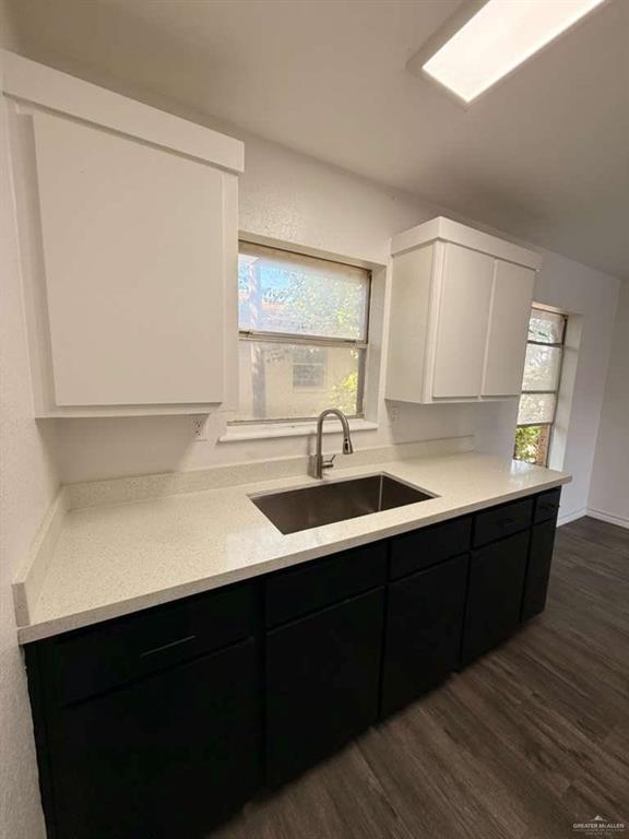 913 West Park Avenue Pharr, TX 78577 - Photo 4 of 9 a kitchen with a sink cabinets and a window