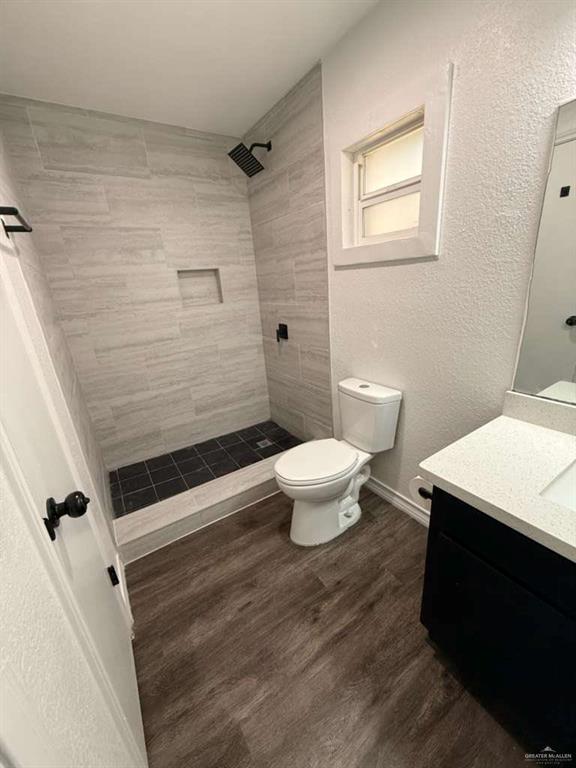 913 West Park Avenue Pharr, TX 78577 - Photo 6 of 9 a bathroom with a toilet and a shower