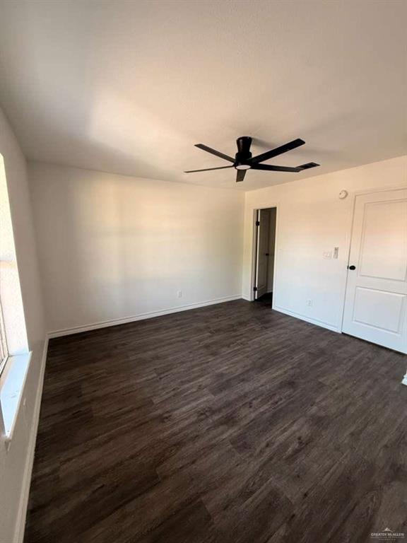 913 West Park Avenue Pharr, TX 78577 - Photo 7 of 9 an empty room with wooden floor and windows