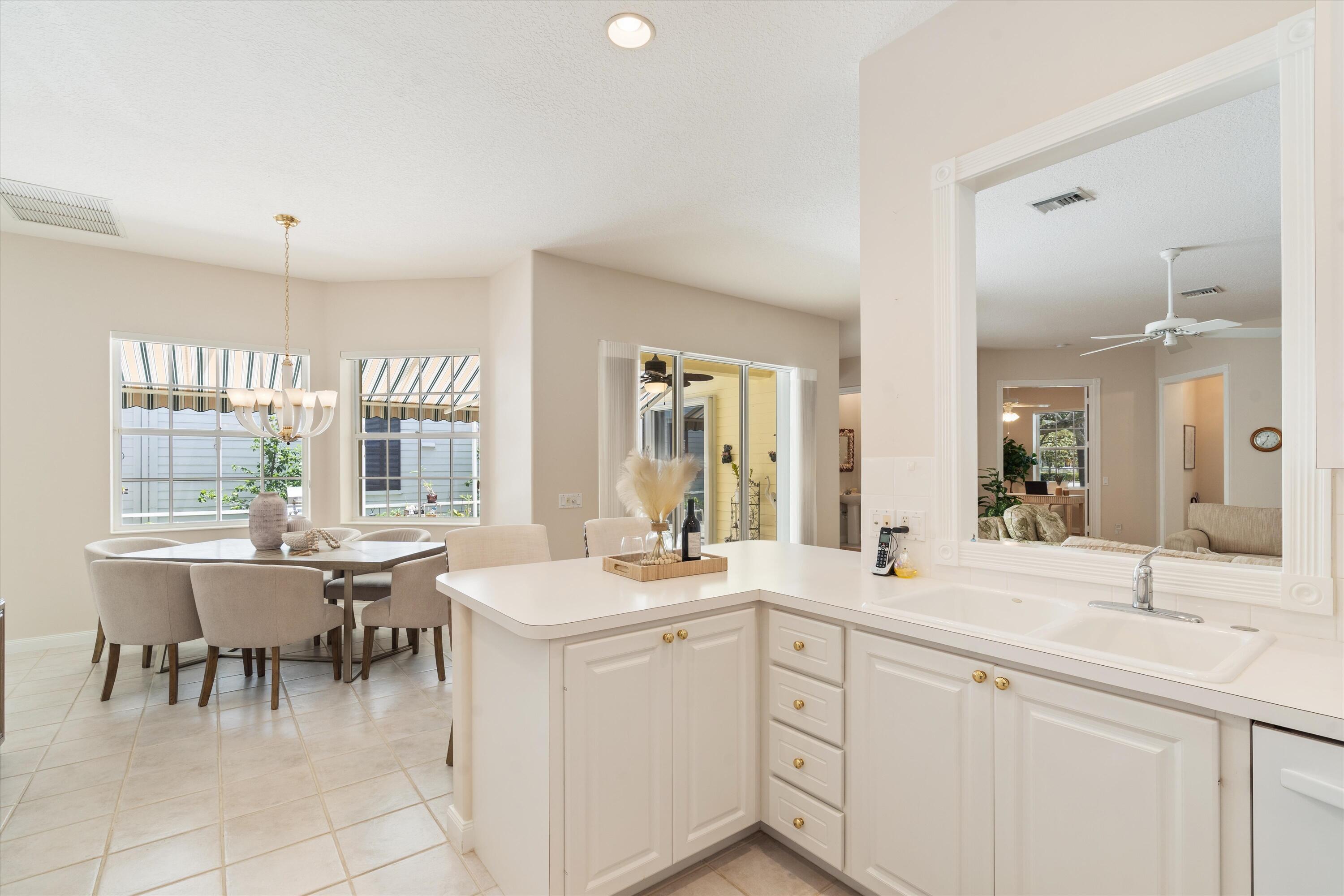 122 Date Palm Drive Jupiter, FL 33458 - Photo 12 of 37 Kitchen to Dining