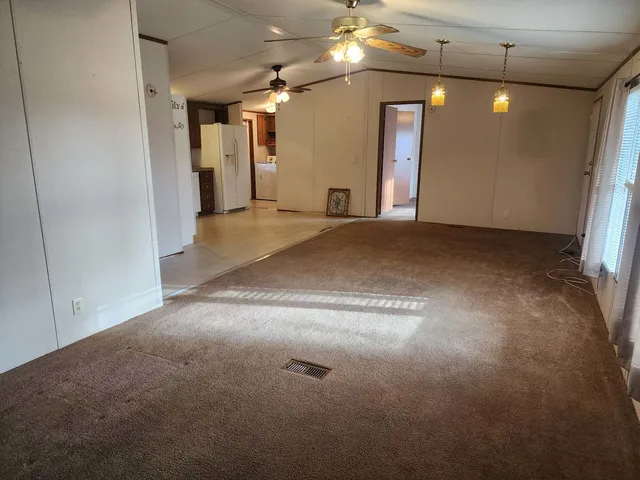 a view of a hallway with a chandelier