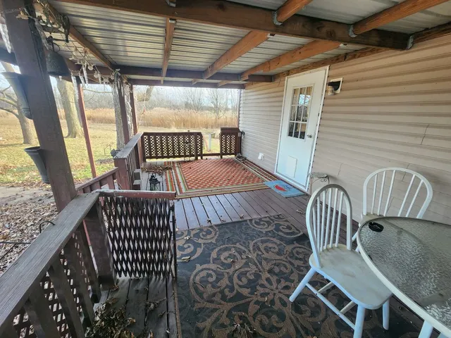 a view of balcony with wooden floor