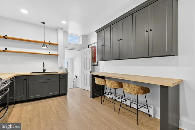 a kitchen with wooden cabinets and sink