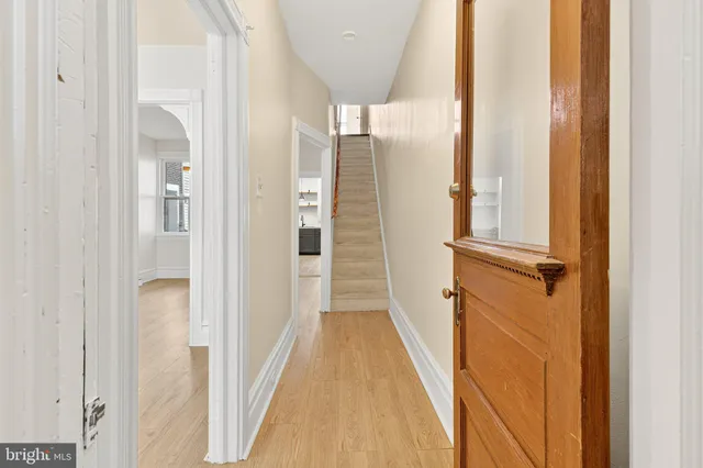 a view of a bathroom from a hallway