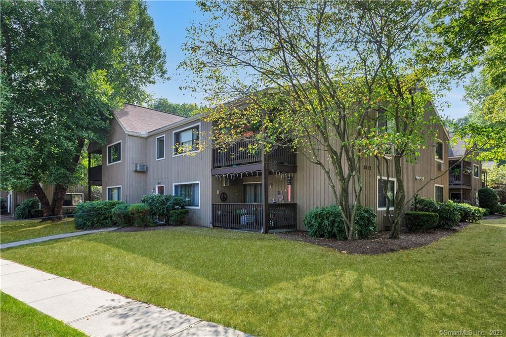 3012 Madison Avenue, Unit G Bridgeport, CT 06606 - Photo 1 of 1 a front view of a house with garden