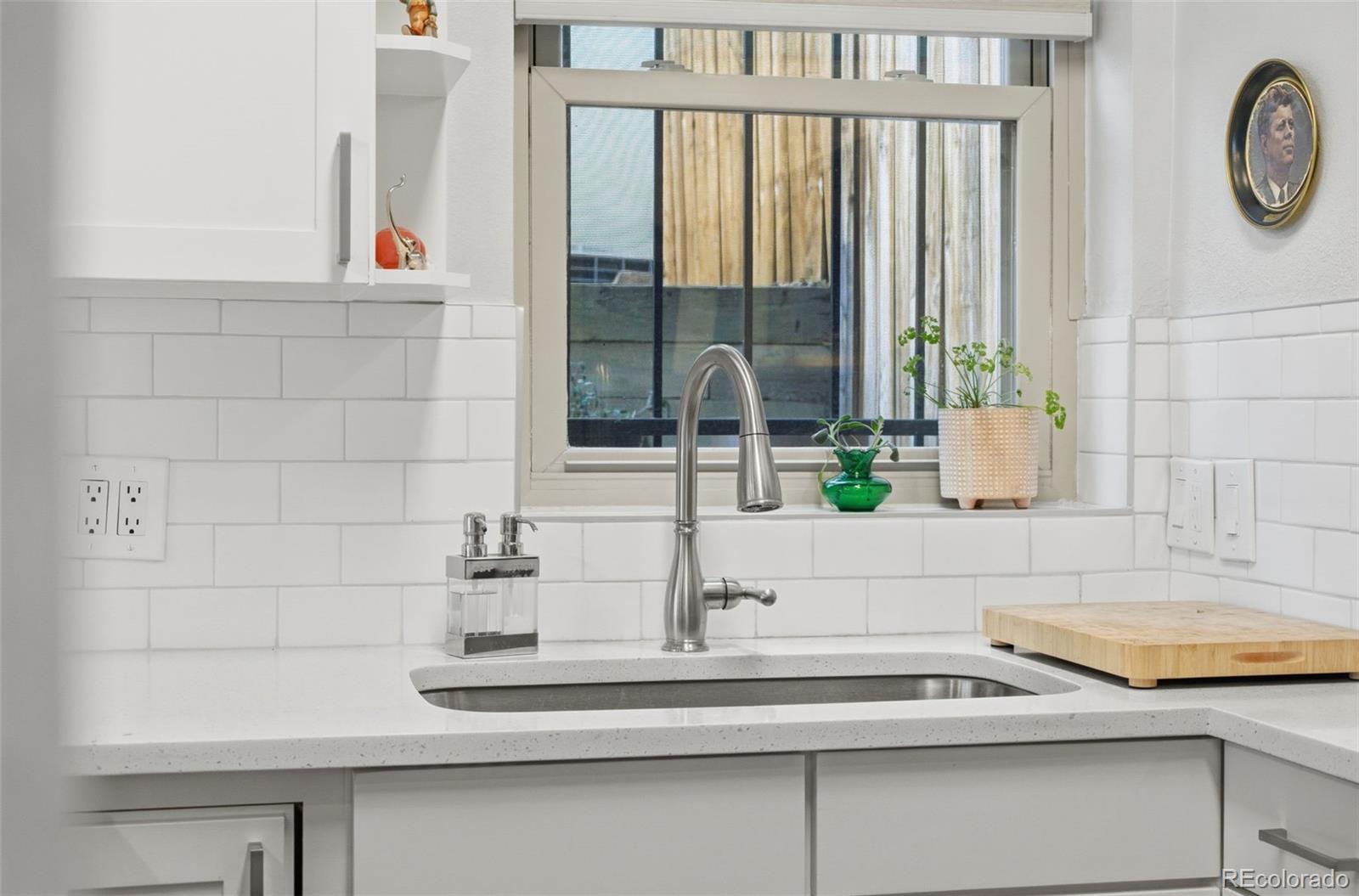 3045 Umatilla Street Denver, CO 80211 - Photo 12 of 48 a bathroom with a sink and a mirror