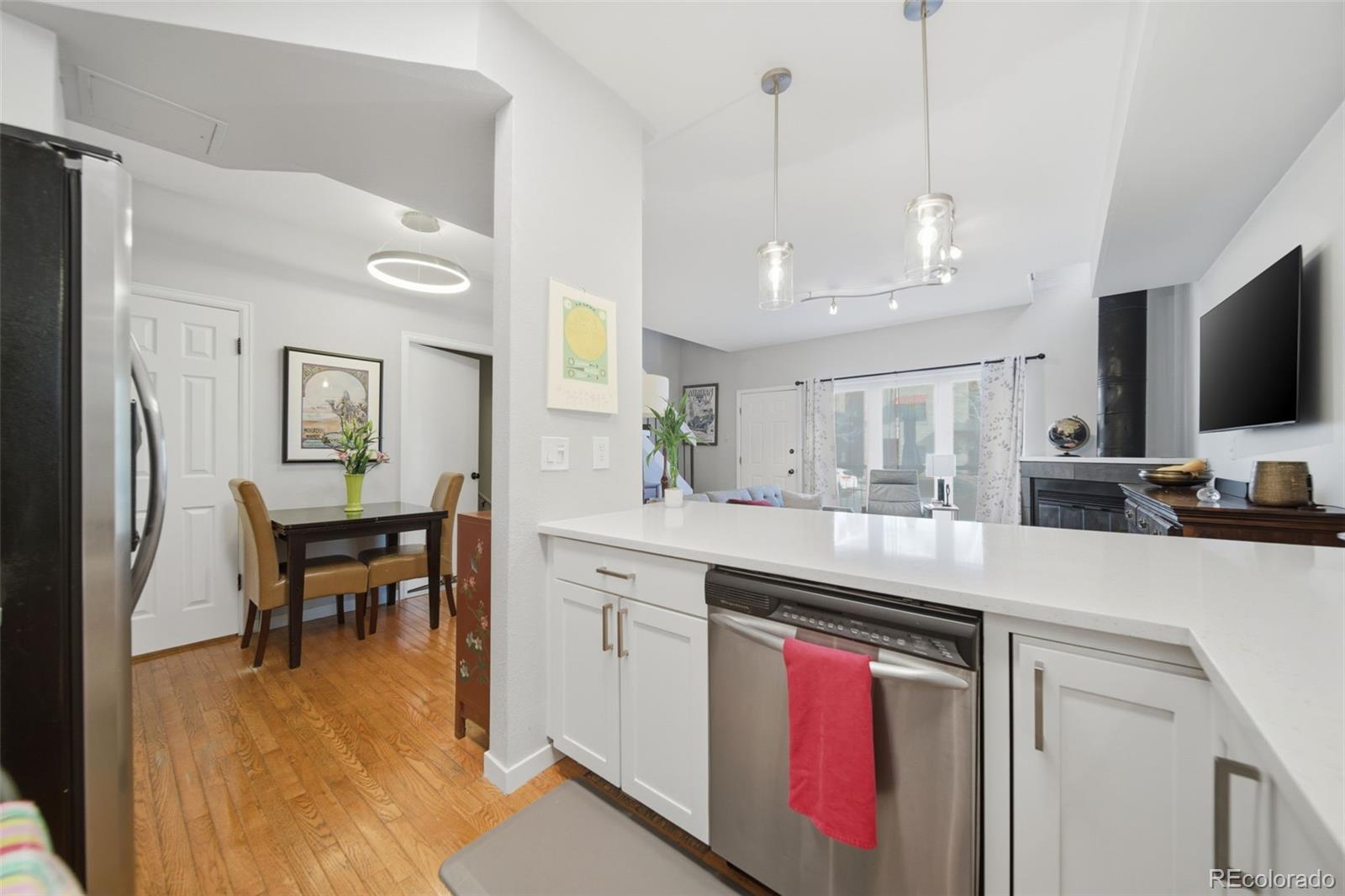 3045 Umatilla Street Denver, CO 80211 - Photo 13 of 48 a kitchen with stainless steel appliances granite countertop a sink a stove and a refrigerator