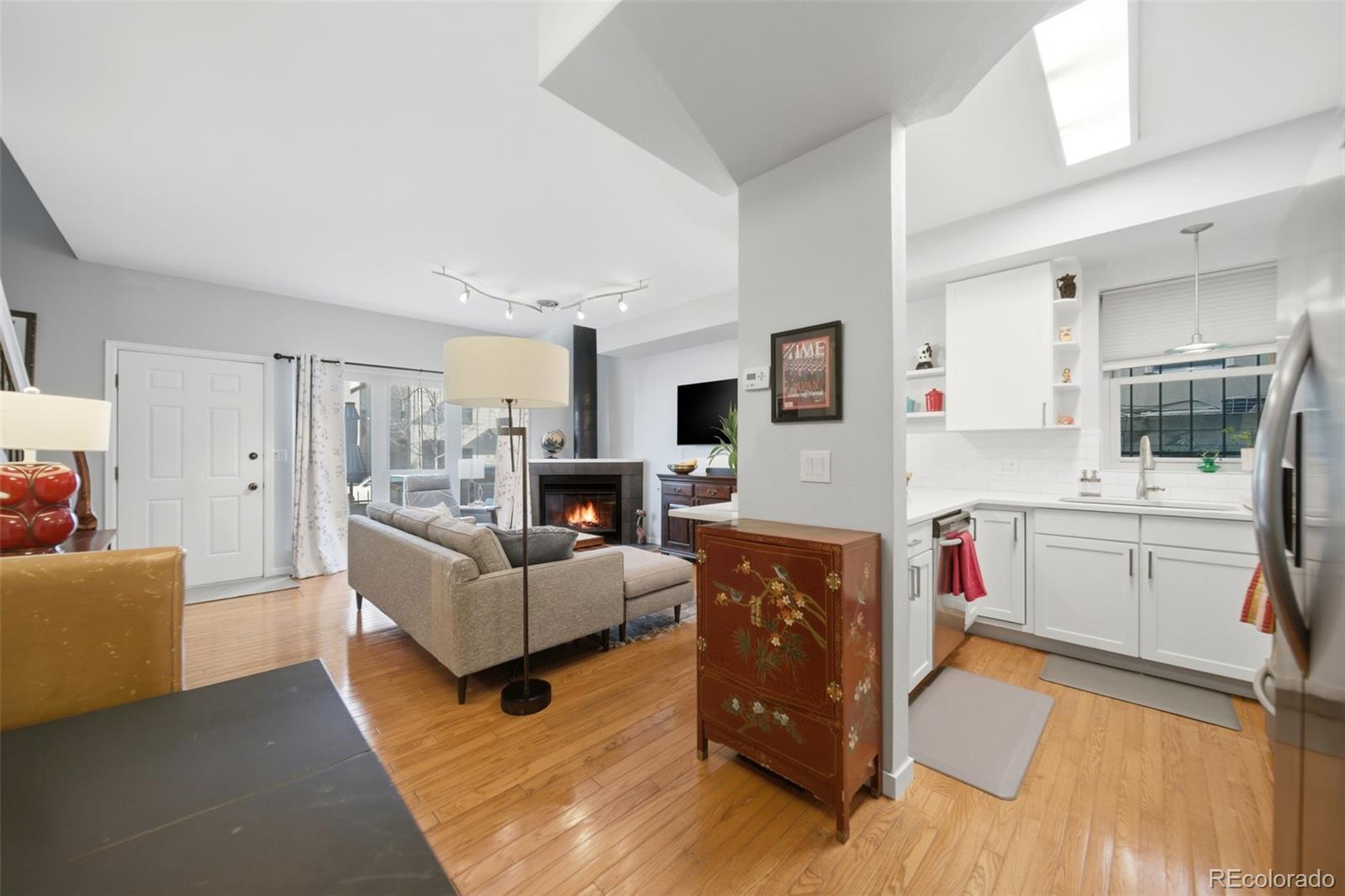 3045 Umatilla Street Denver, CO 80211 - Photo 15 of 48 a living room with furniture and a flat screen tv
