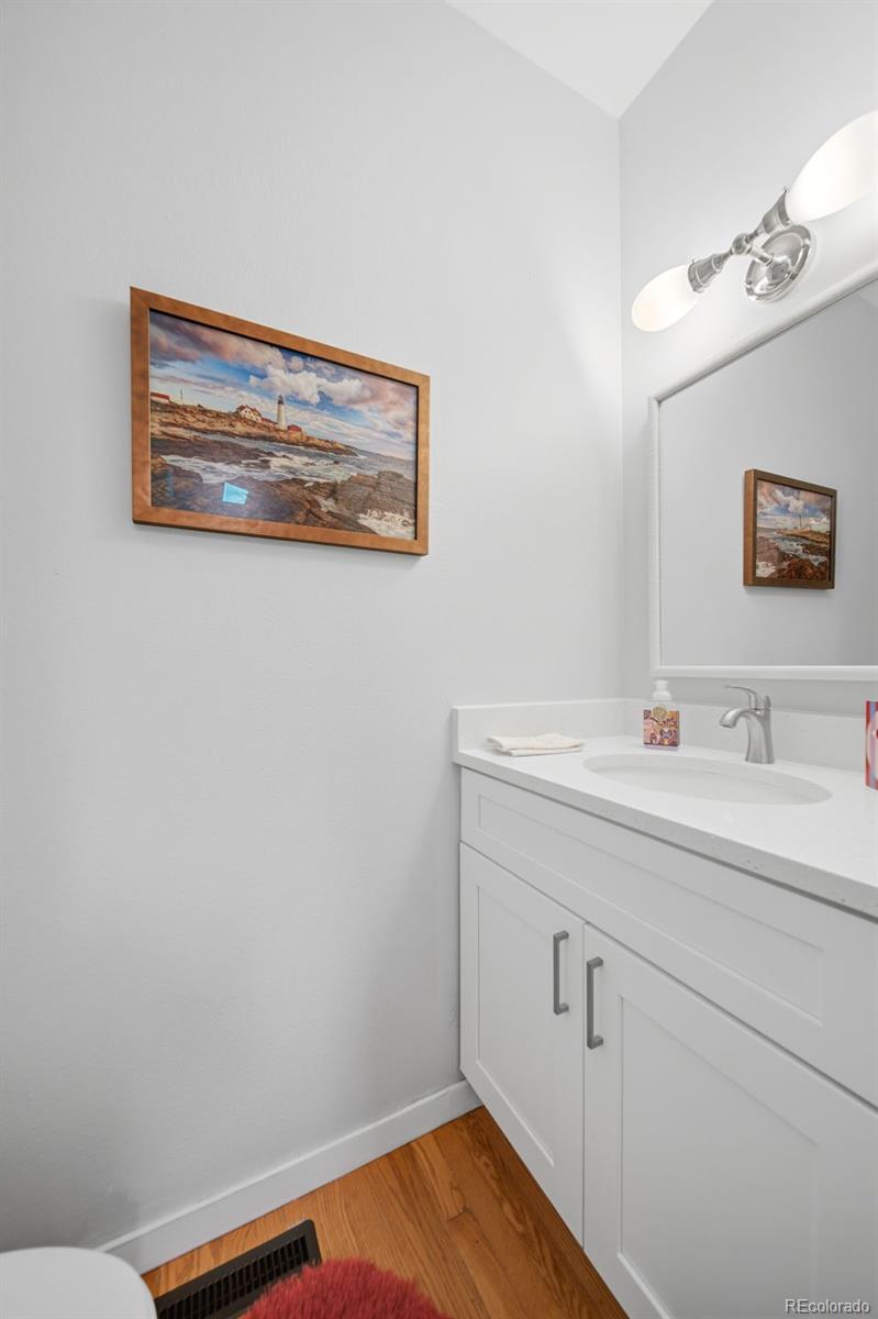 3045 Umatilla Street Denver, CO 80211 - Photo 16 of 48 a bathroom with a sink and a mirror