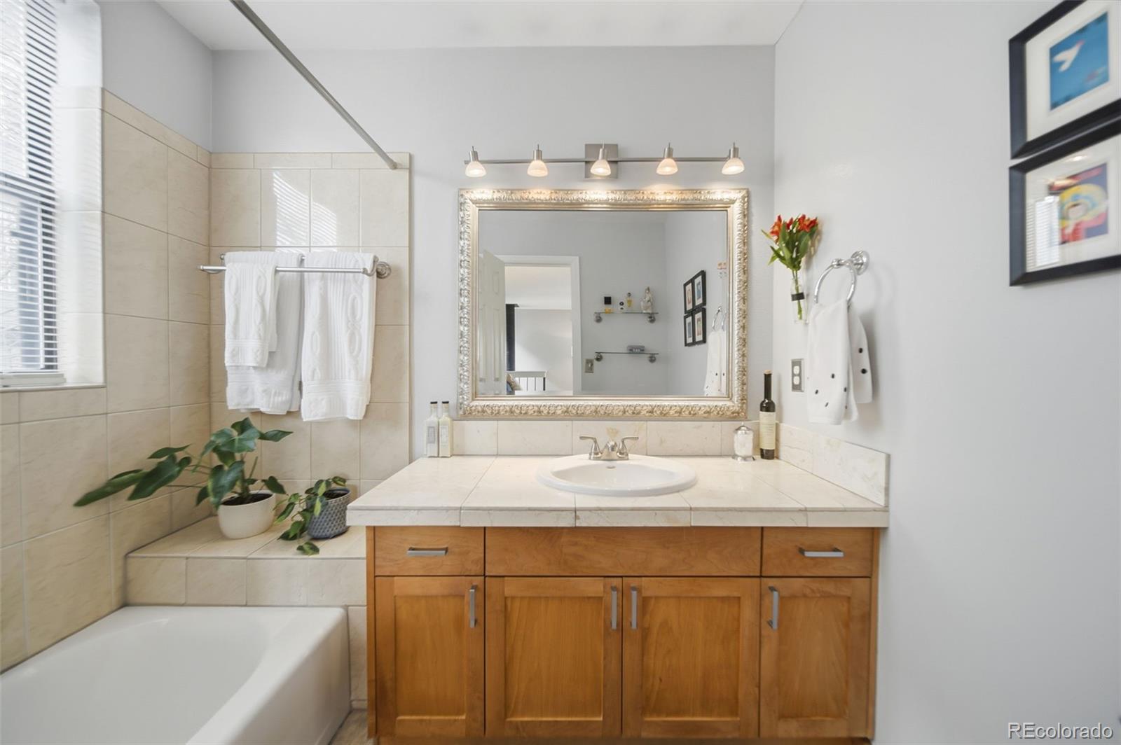 3045 Umatilla Street Denver, CO 80211 - Photo 17 of 48 a bathroom with a sink and a mirror
