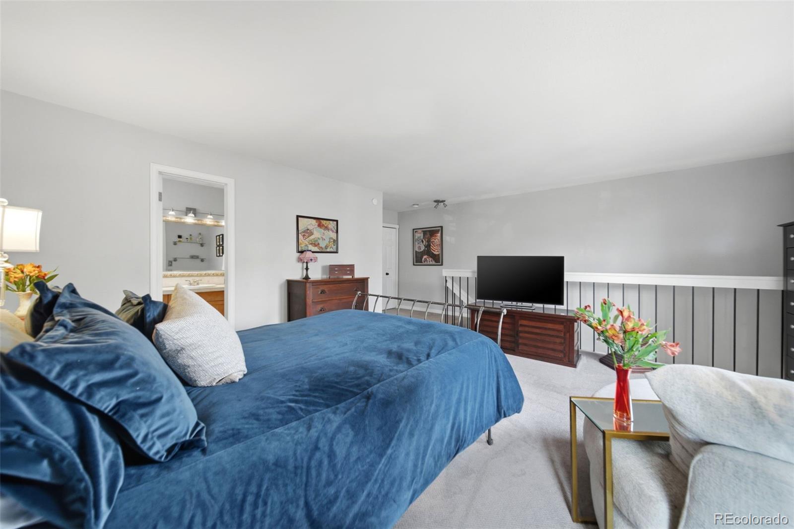 3045 Umatilla Street Denver, CO 80211 - Photo 20 of 48 a bedroom with a bed and a flat screen tv