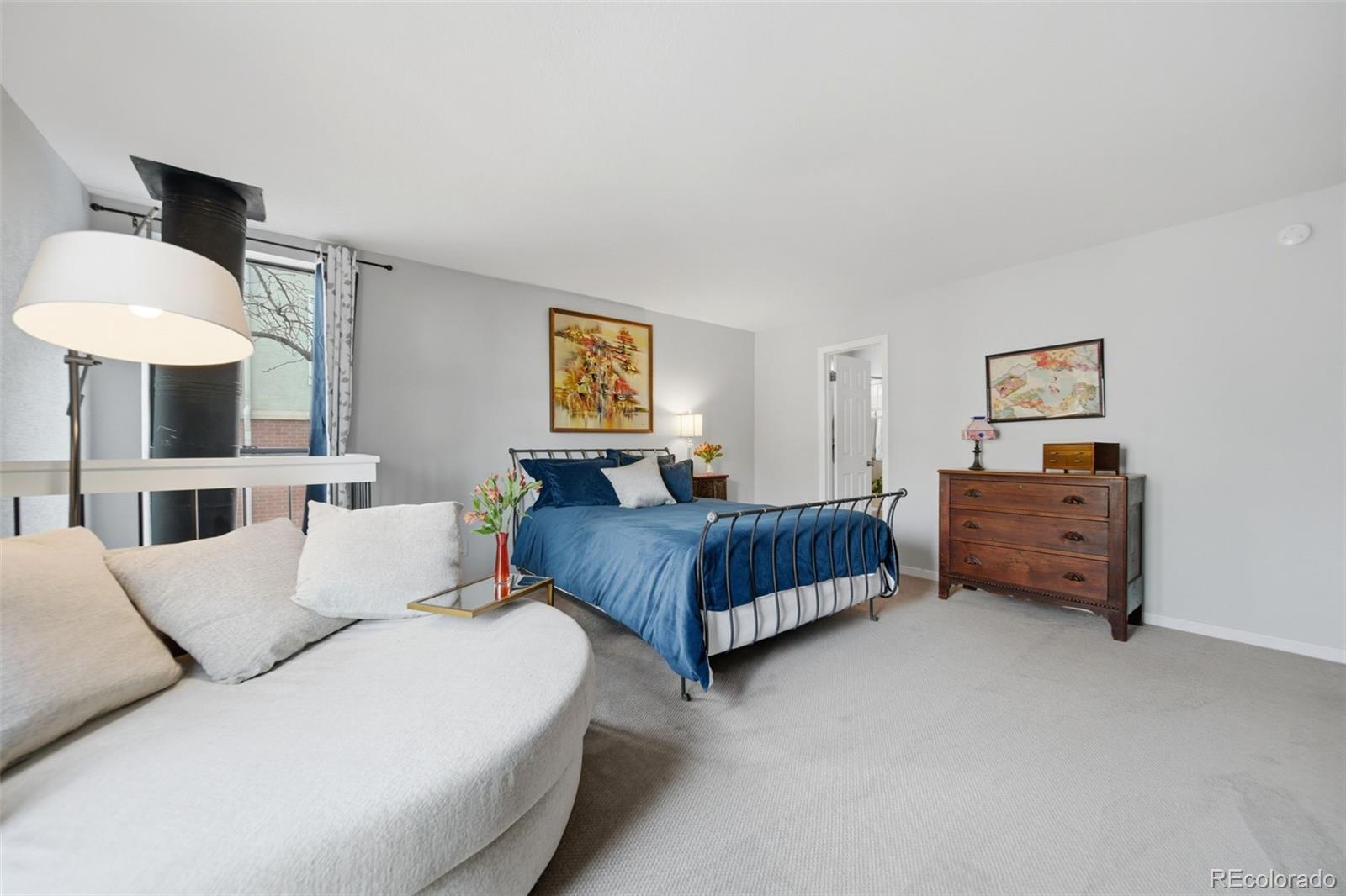 3045 Umatilla Street Denver, CO 80211 - Photo 22 of 48 a bedroom with bed and window