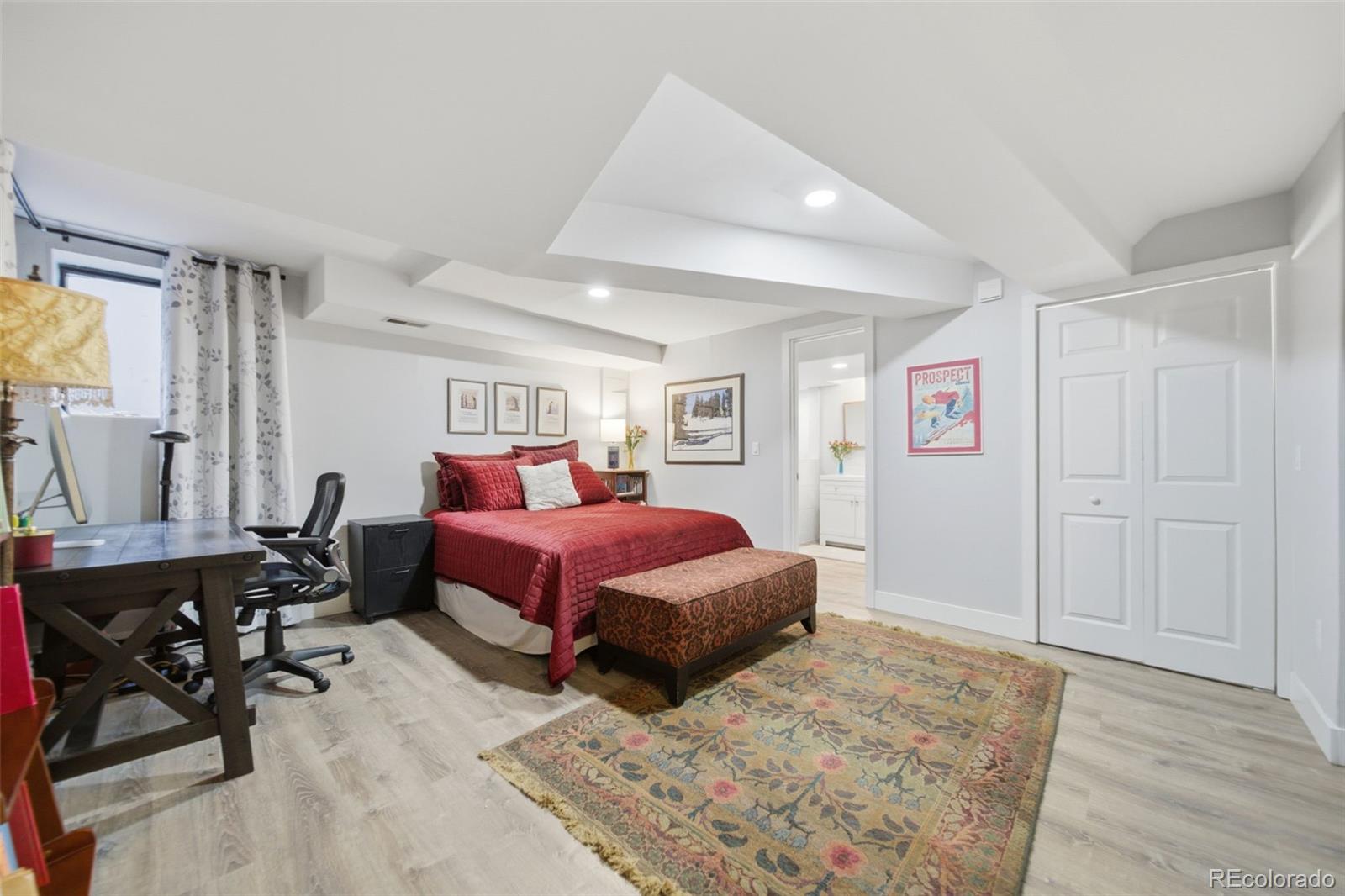 3045 Umatilla Street Denver, CO 80211 - Photo 24 of 48 a bedroom with a bed a table and chair