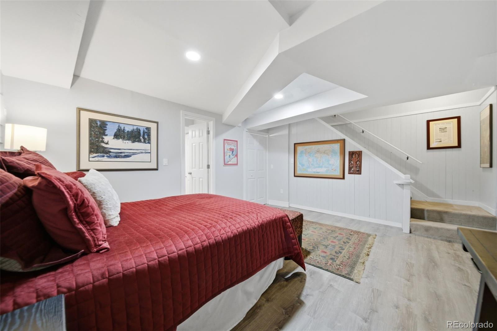 3045 Umatilla Street Denver, CO 80211 - Photo 25 of 48 a bedroom with bed and painting on the wall